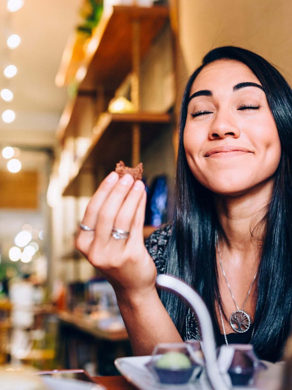 woman enjoying a bite of food