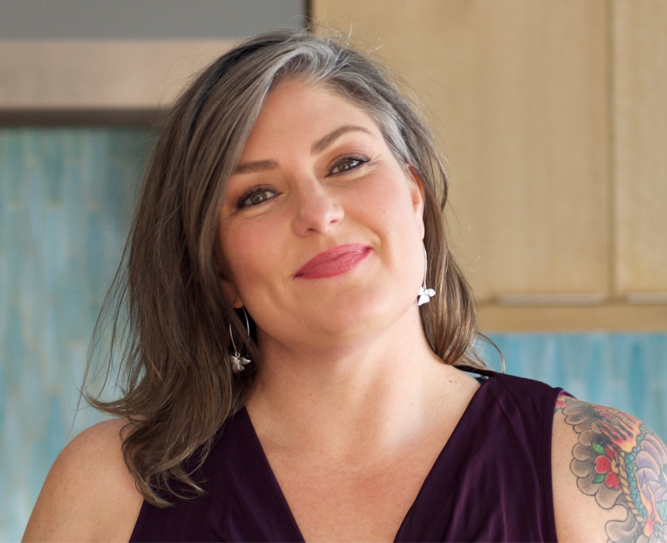 woman in her kitchen smiling